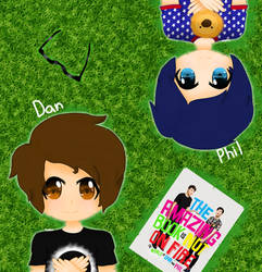 Dan and Phil lying on the grass