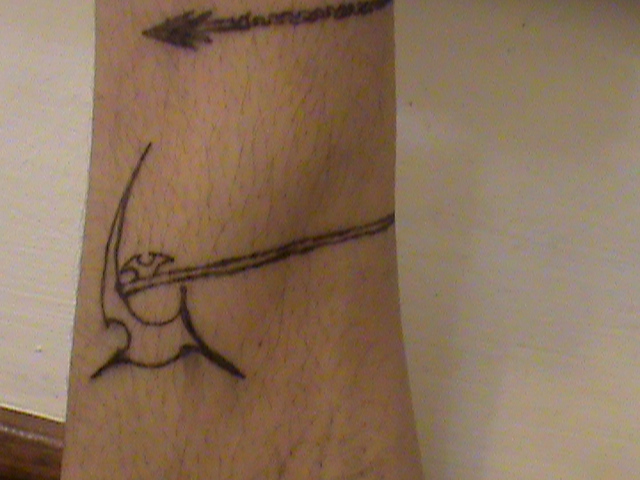 cant tell if its an axe or scythe head... tattoo