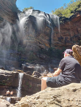 Sitting at the base of Wentworth Falls, NSW