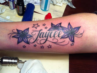 flowers with script tattoo