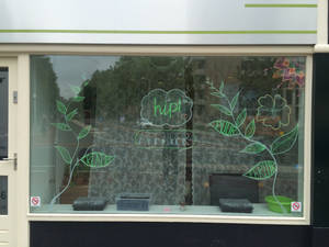 painting on window for Hip! 