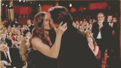 Christian and Sibi kiss Oscar