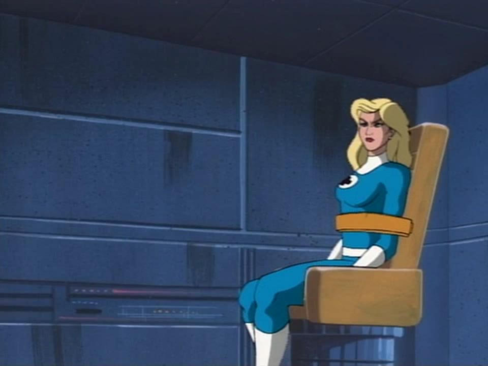 Invisible Woman strapped to a chair