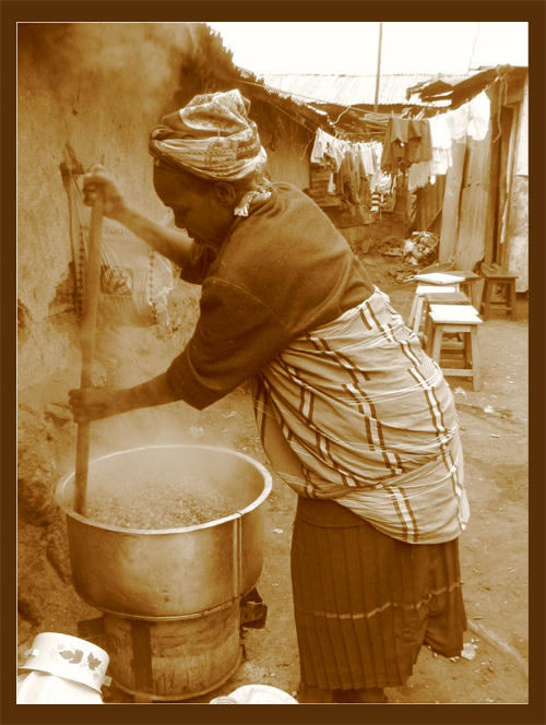 Slum woman cooking