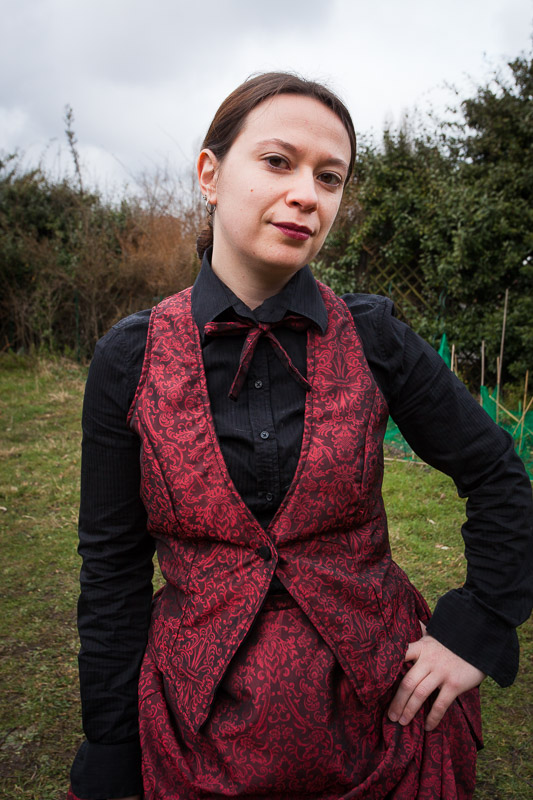 Red bustle ensemble - close up on waistcoat