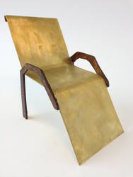 A chair model made of Brass