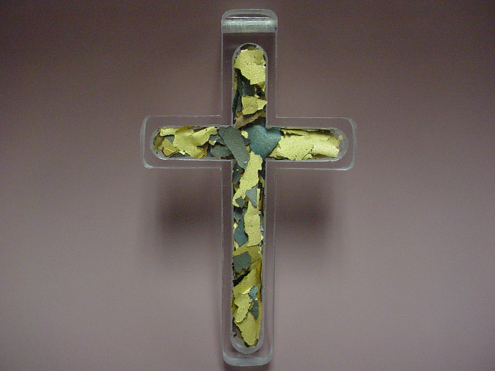 tossed metal cross