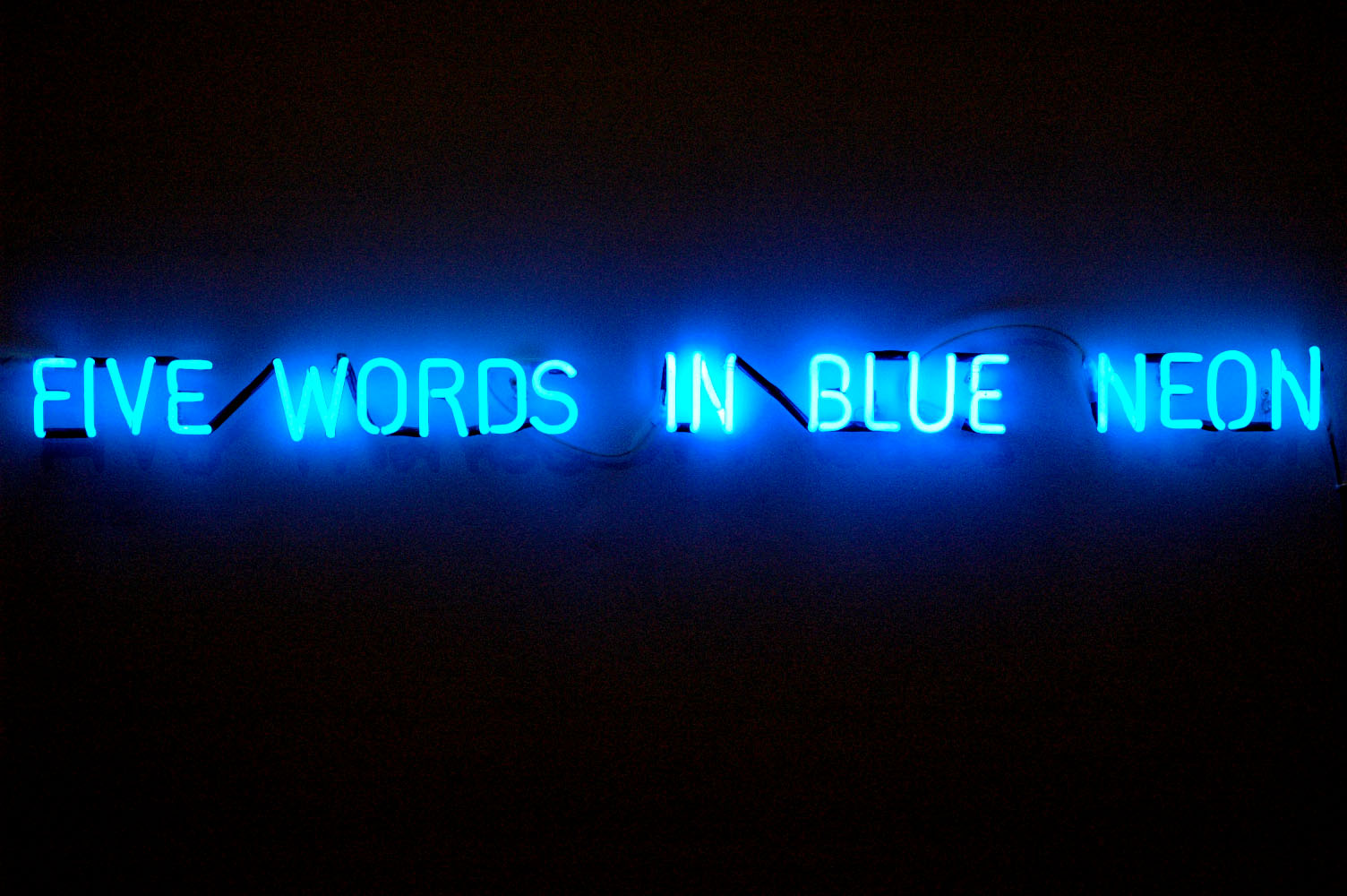 Five words in blue neon