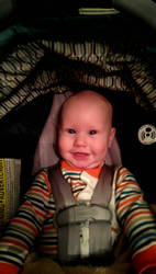 Denis in his car seat