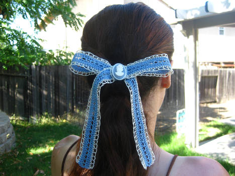 Blue crochet lace bow with cameo