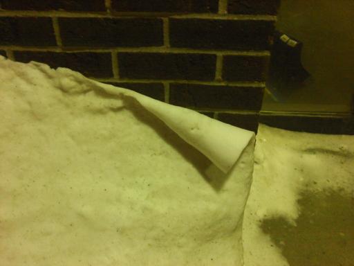 Curled Snow on Wall