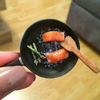 Miniature salmon in frying pan