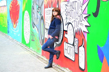 girl on a graffiti wall