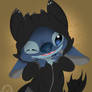 Stitch in a Toothless hoodie.