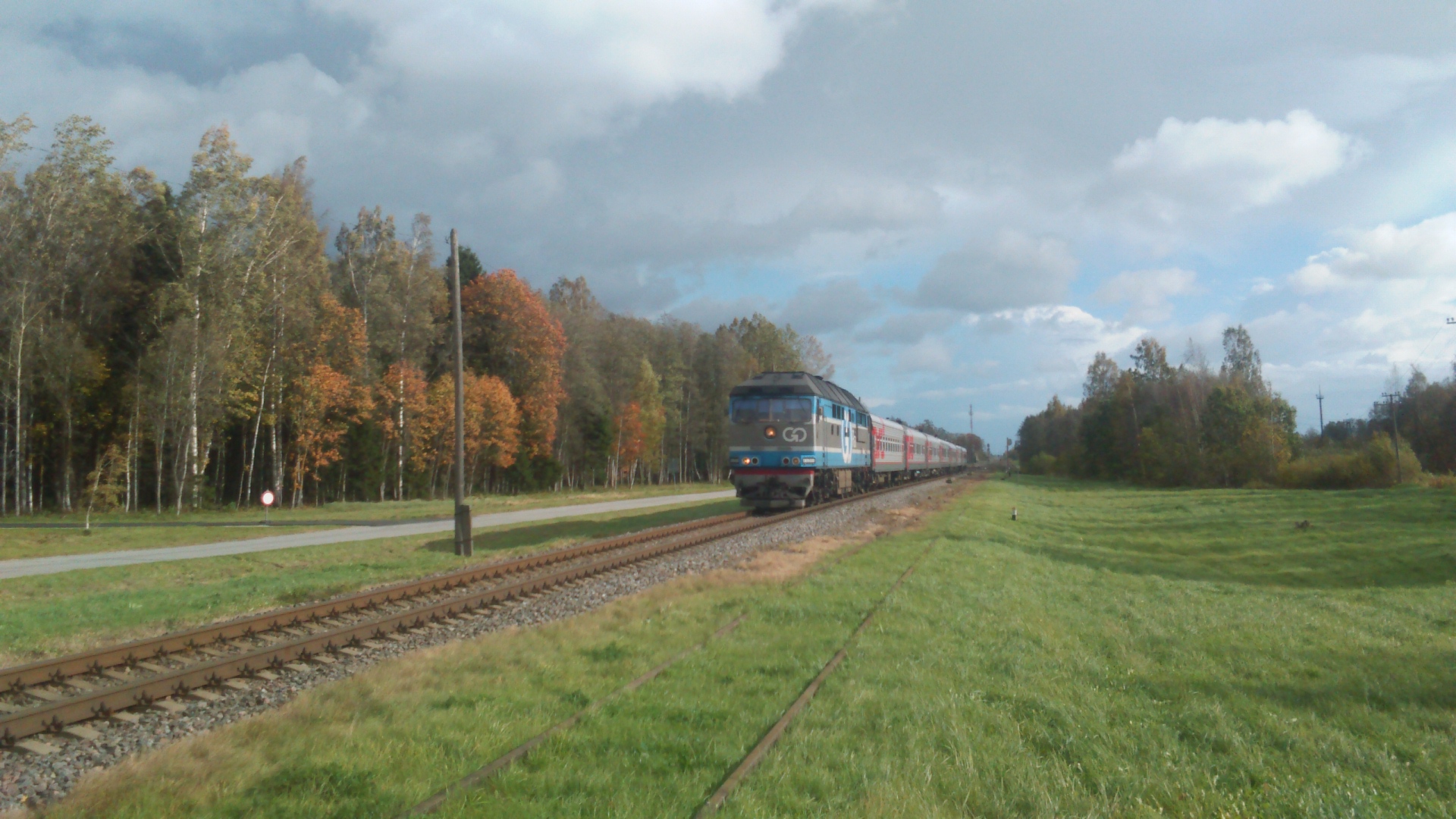 GO Rail TEP-70 0320 near a railway crossing