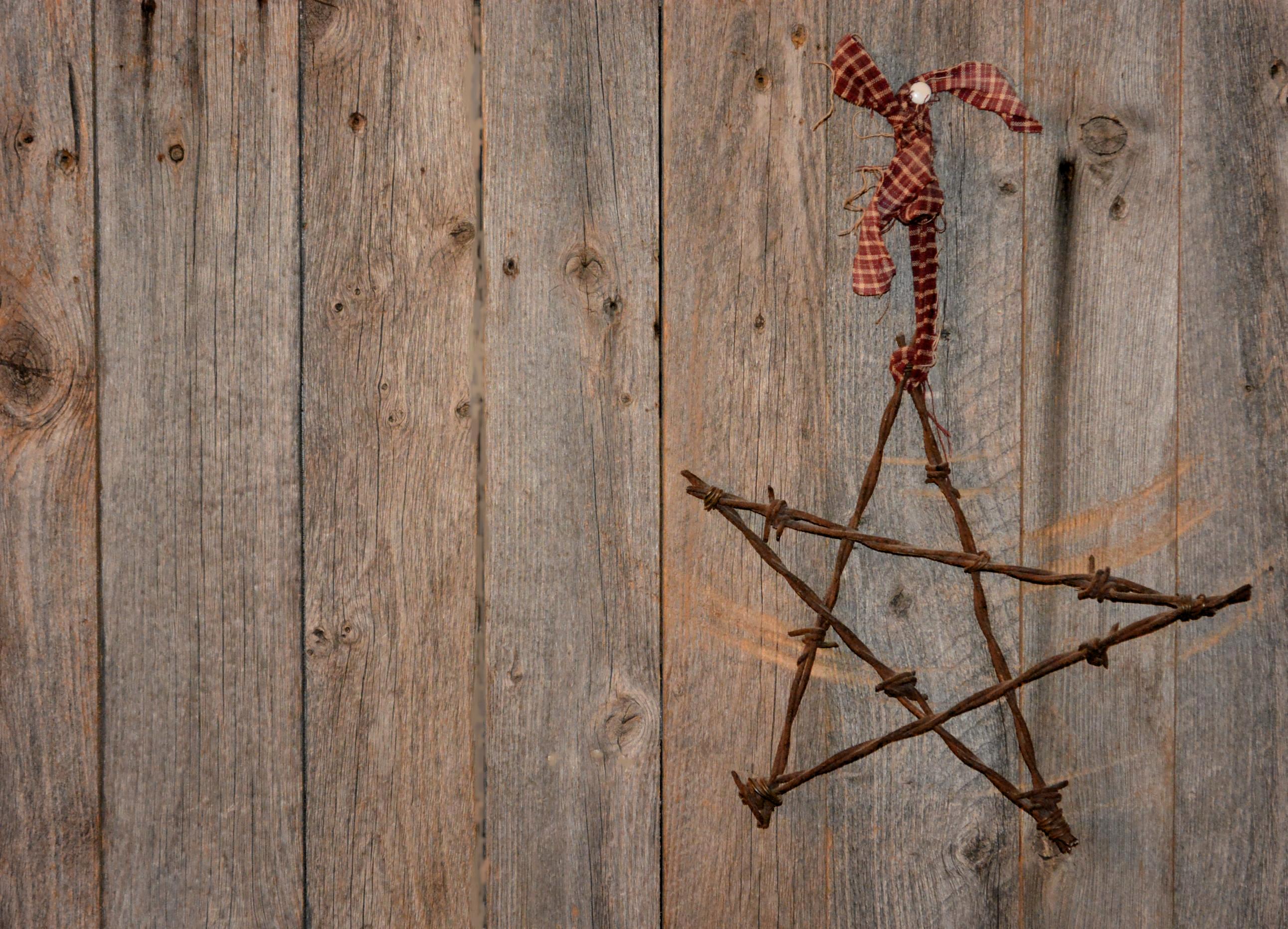 Rusty Metal Star On Barnboard