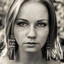 Freckled girl with long earrings