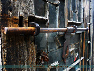 An Old Door With Rusted Latch