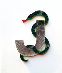 Paper quilled card: J with snake wrapped around it
