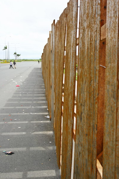 by the rusted fence