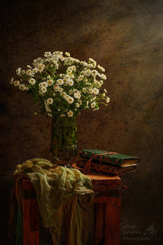 Wild flower still life with books