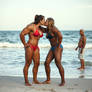 Two very muscular girls in bikini with huge biceps