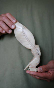 Husbands carving snowy owl