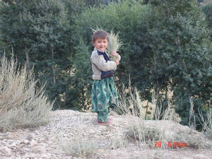 Afghan child in native garb knit wool