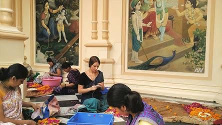 Ladies making garlands @ Iskon Temple