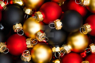 Background of red, black and gold Christmas balls.