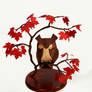 Origami owl in a maple tree