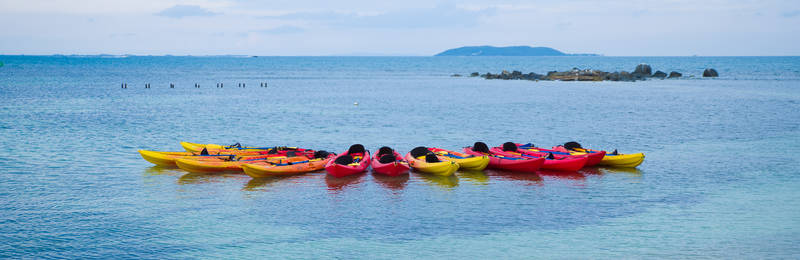 Kayaks and Canoes in ocean