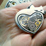 Heart-shaped steampunk cat pendant