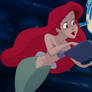 Ariel reads a book to flounder
