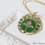 Mucha's lily Art Nouveau green pendant