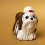 Brown and white Shih Tzu dog sculpture