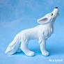 Howling white wolf sculpture