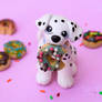 Dalmatian puppy with donuts