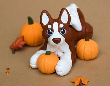 Husky puppy with pumpkins sculpture