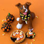 Pit bull puppy with pumpkin pie sculpture
