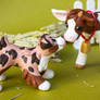 Baby cow and Aussie pup best friends sculpture