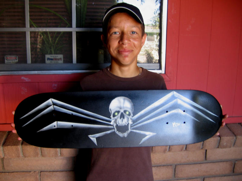 Zach with his skateboard