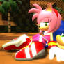Amy sitting on Sonic