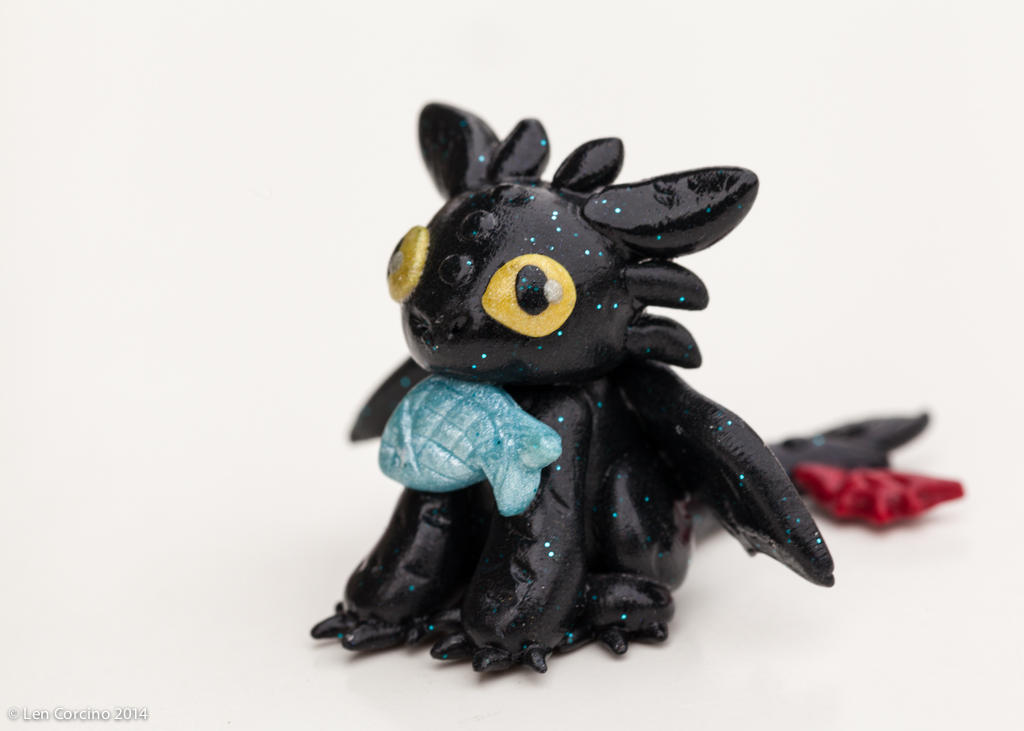 Toothless with a fish by UlulaCreations on DeviantArt