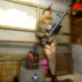 Tank Girl, a toy and 2 big ole guns...
