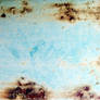 Rust texture on a blue barrel