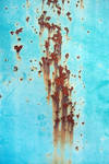 Dripping rust on blue metal