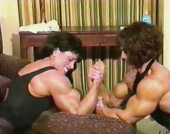 Female wrestling with bicep