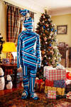 Gift-Wrapped-Person-and-Christmas-Tree-GoGetGifted by RavynCrowe