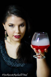 There are two drinks the color of red wine...